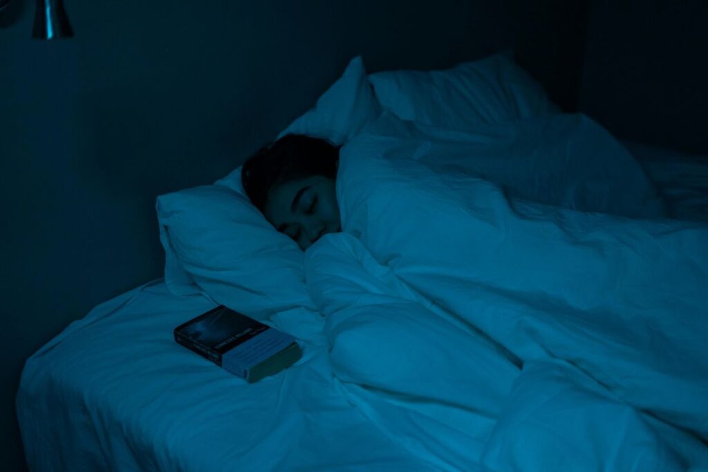 person in bed at the middle of the night