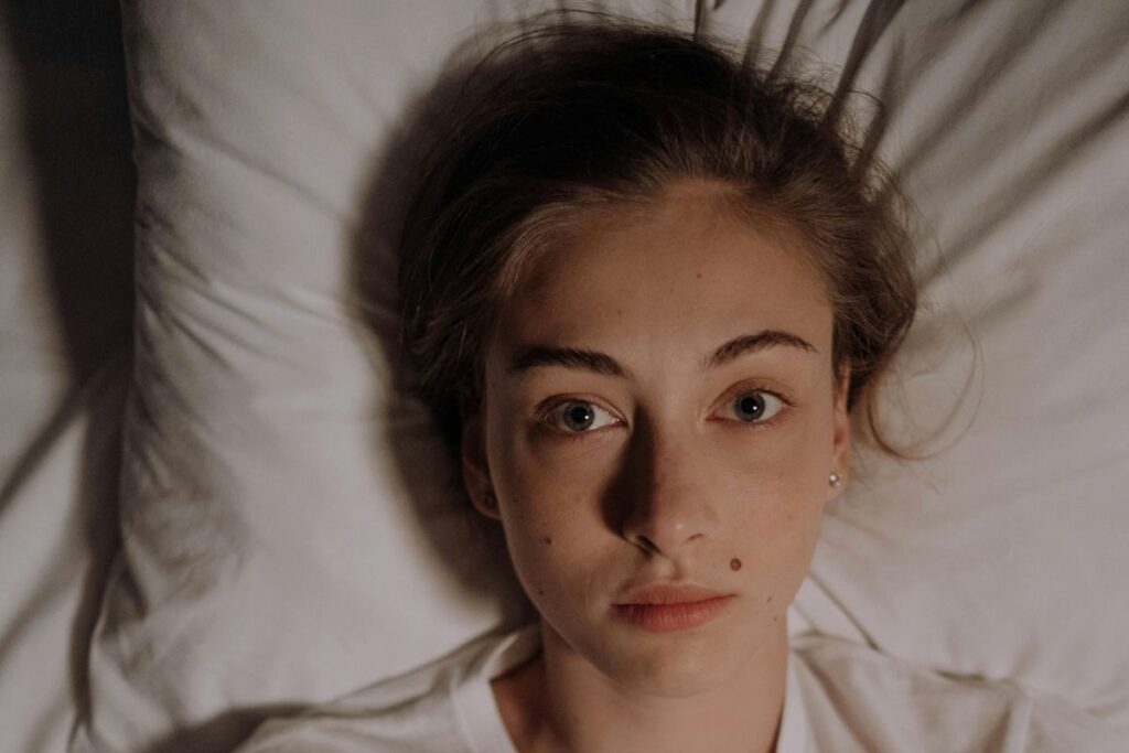 Person lying in bed unable to breathe at night