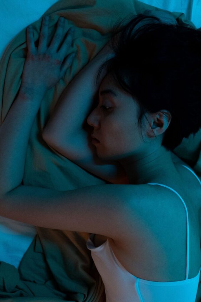 woman overthinking in bed because she is a light sleeper 
