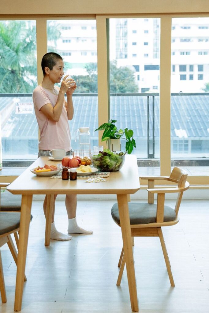 person drinking and eating because of waking up shaky