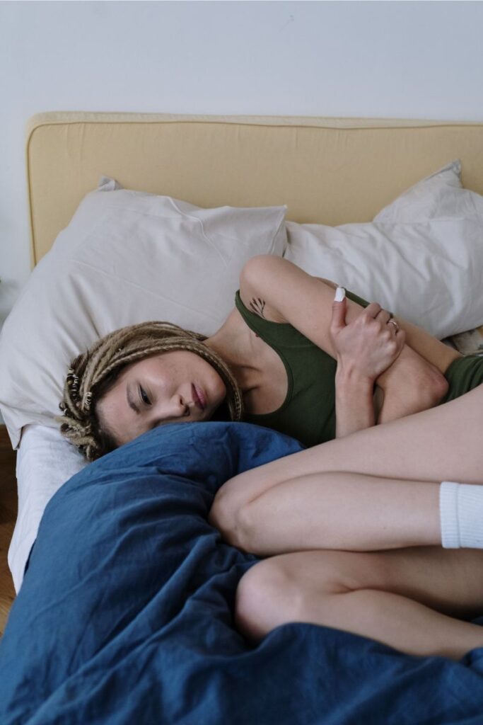why do i wake up feeling weak, woman lying in bed